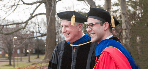 AREC Ph.D. Program. Photo of Professor Richard Just and Ph.D. recipient Ariel Ortiz-Bobea.